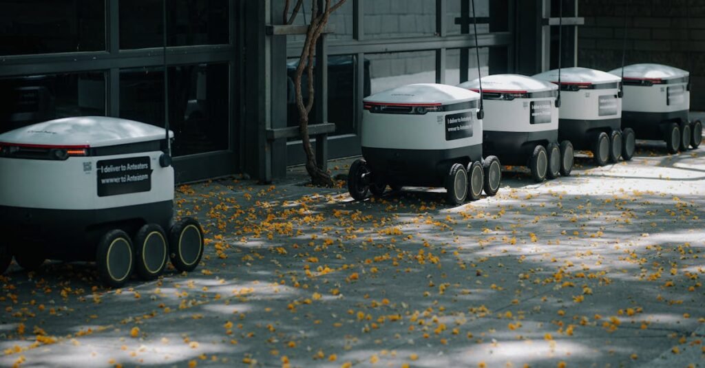 Autonomous delivery robots lined up outdoors showcasing modern transportation technology innovations.